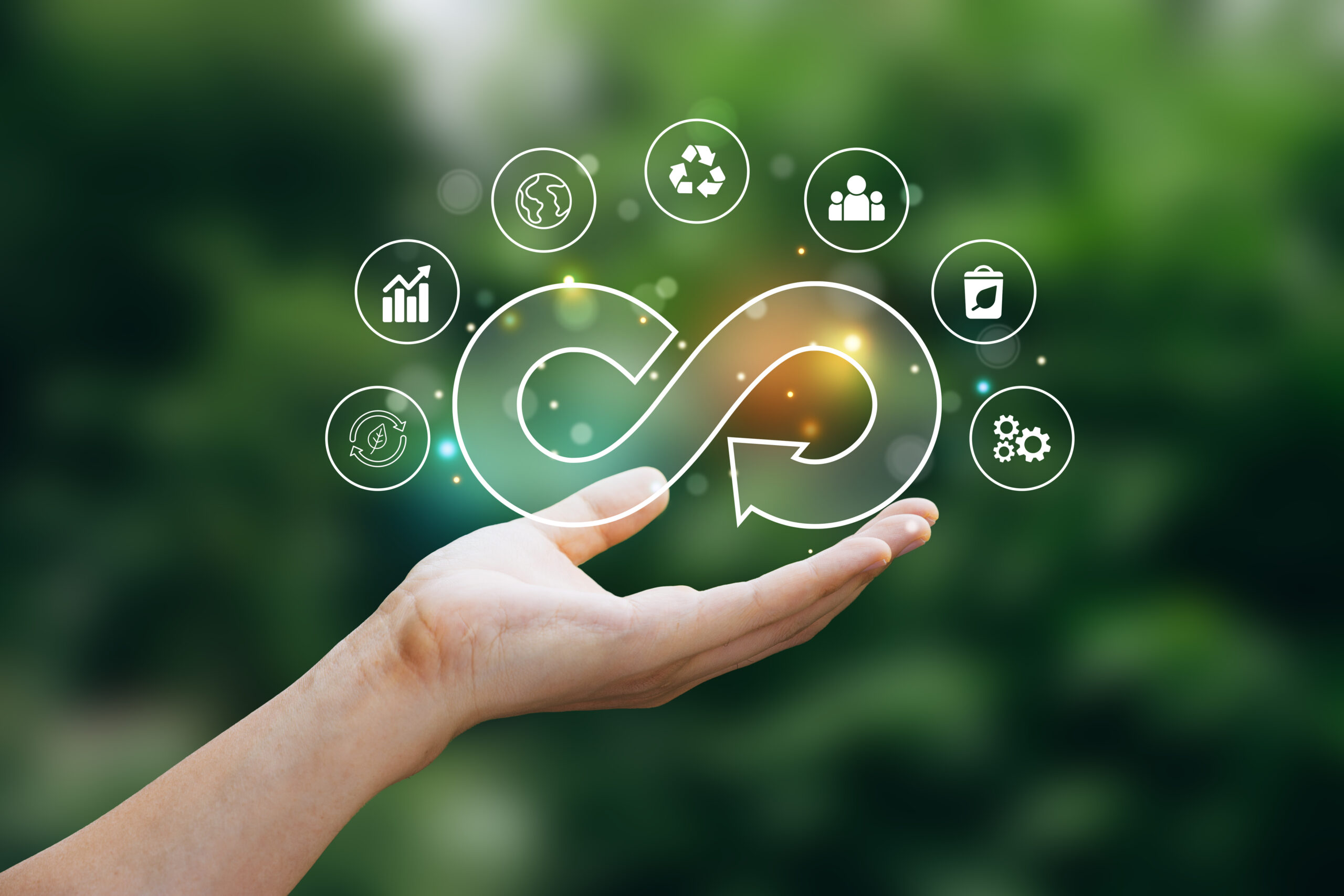 Hand of human holding economy circular icon.